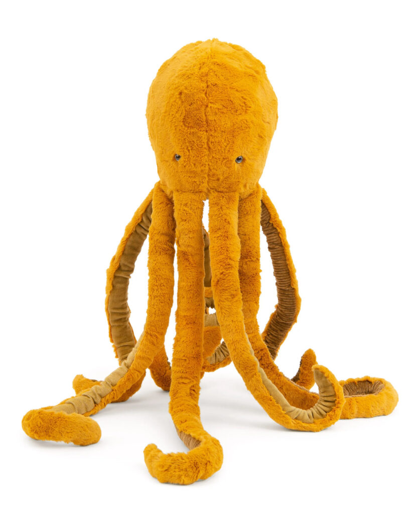 Photograph of large orange plush octopus from French designer toy company Moulin Roty
