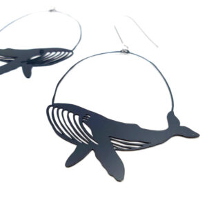 Black and white image of whale earrings