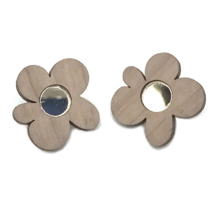 Colour photograph of cherrywood flower studs by Foxie Collective